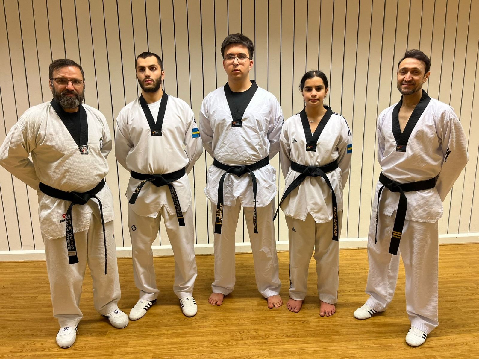 a group of coaches with karate uniform