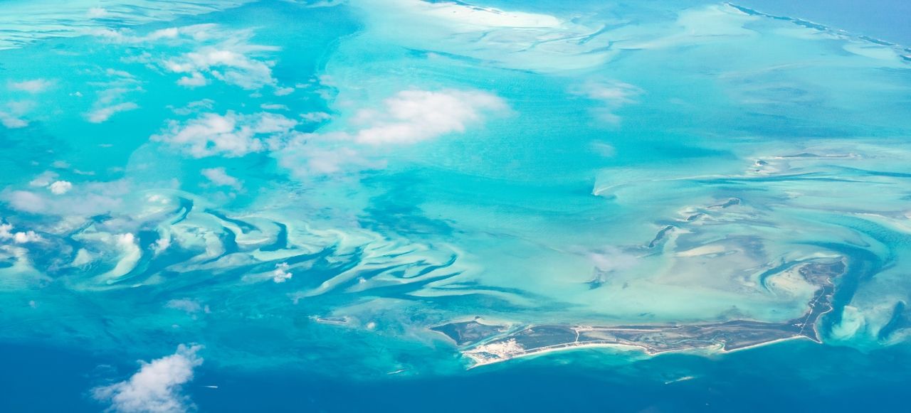 Aerial view of the Bahamas Berry Islands, stunning islands, sand bars and coral reefs with turquoise sea, shot from aeroplane