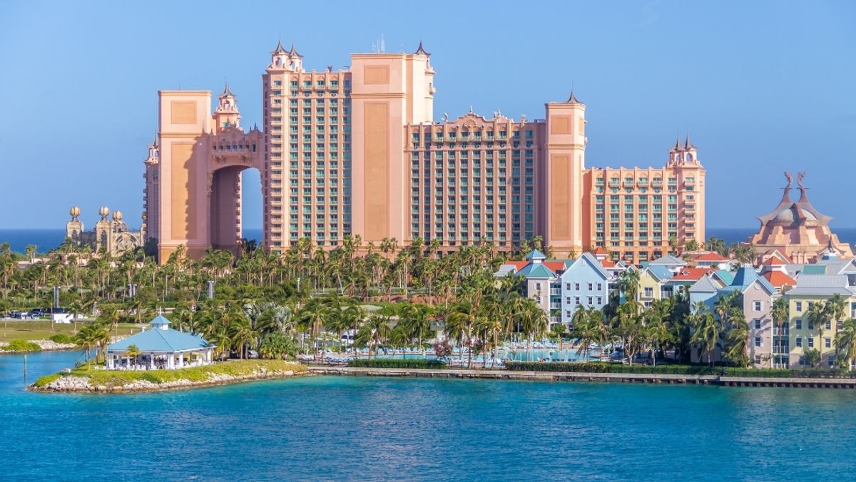 City Building Near Body of Water under Blue Sky