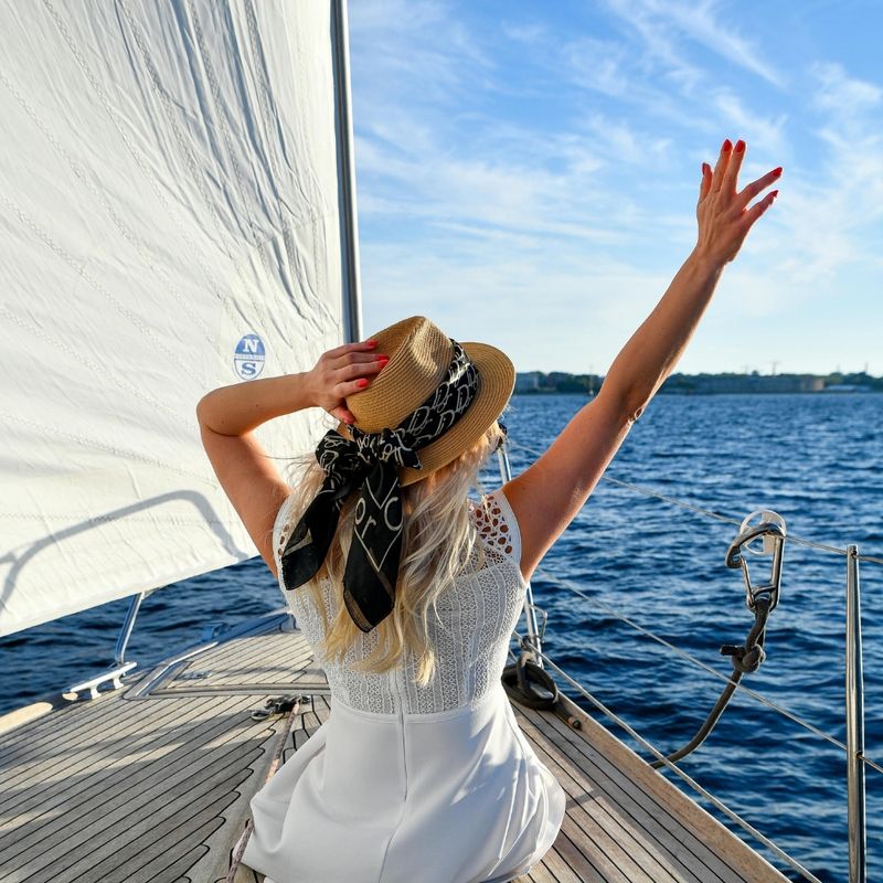 Woman Enjoying Leisure on a Yacht