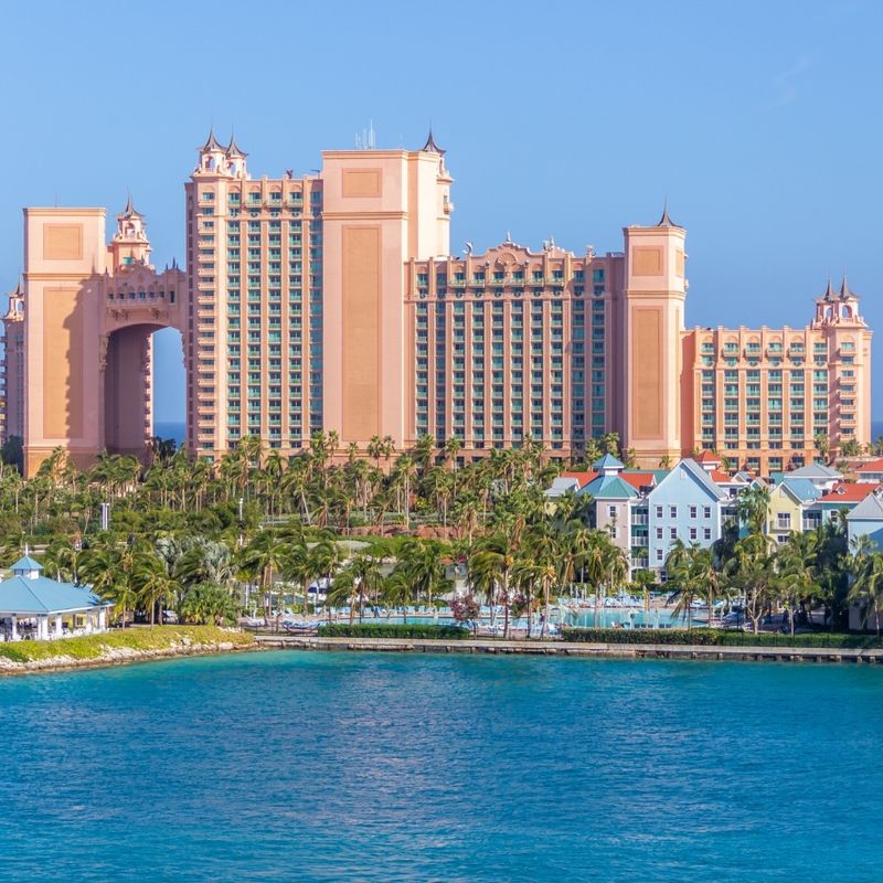 City Building Near Body of Water under Blue Sky