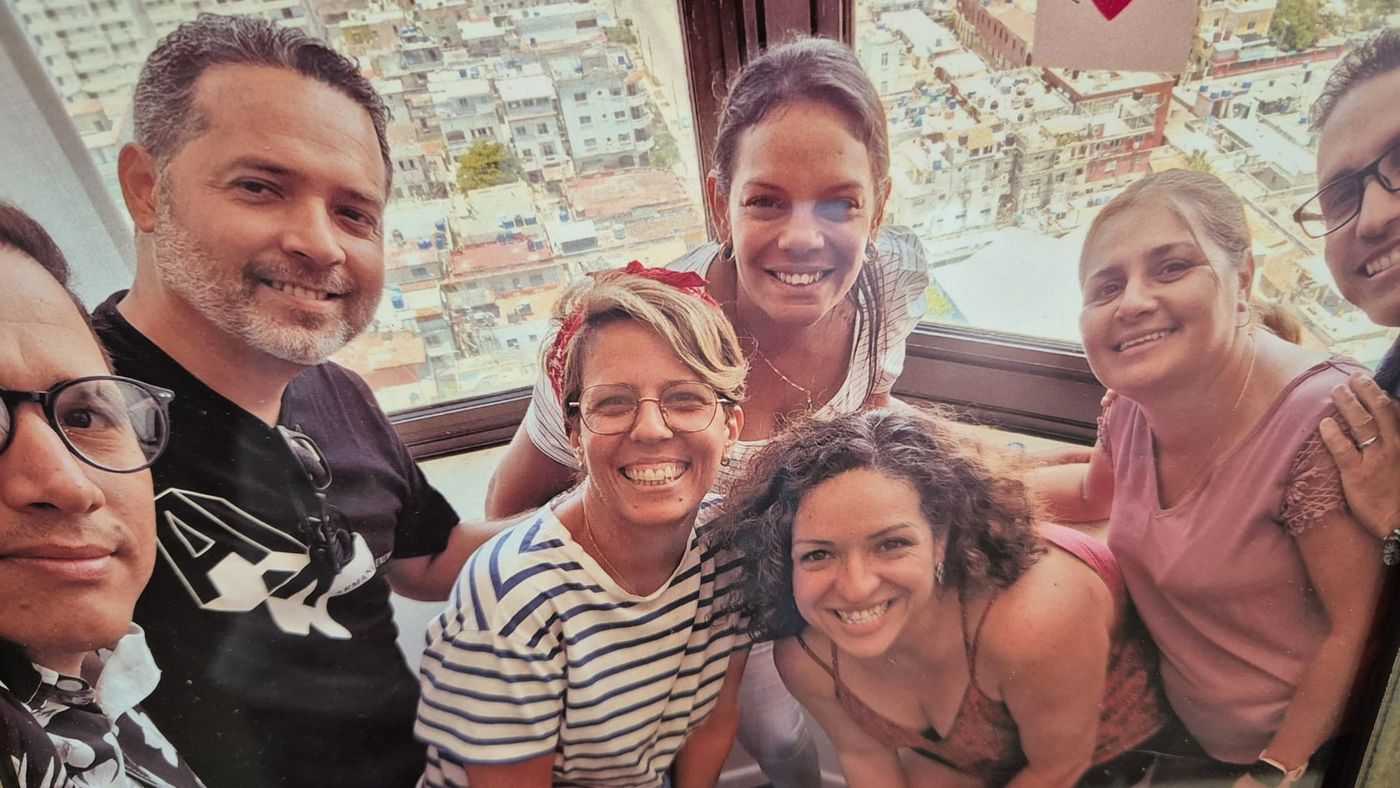 Maria and the Havana team, a window open over the city's rooftops.