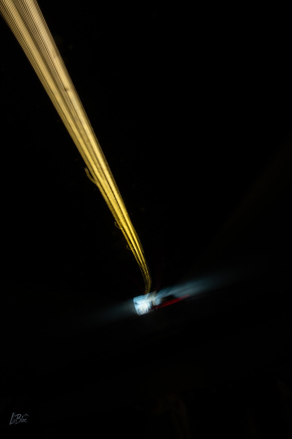 Golden light trails meet the first cold-blue evidence of the tunnel exit