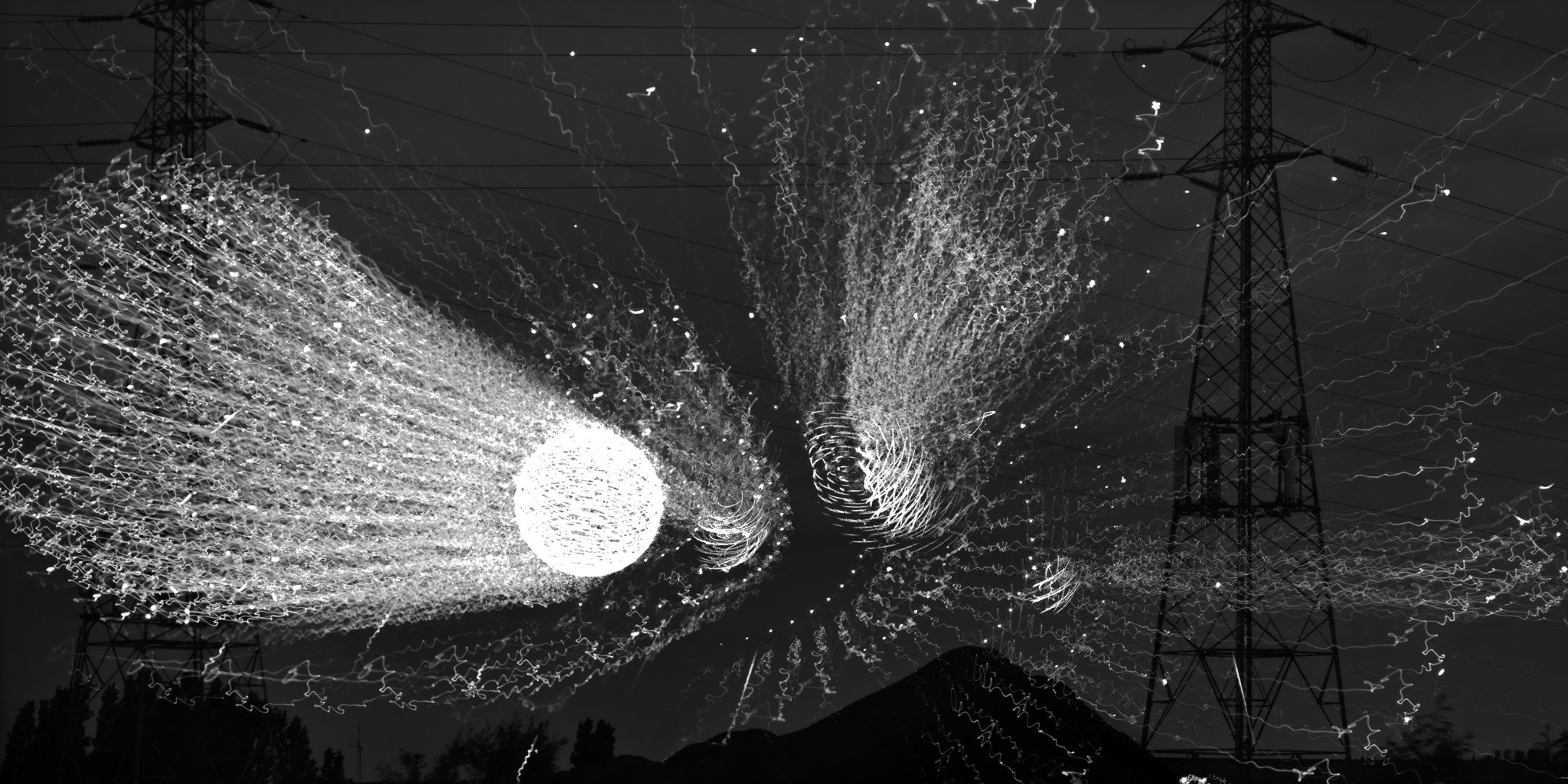 White electrical structures erupting across a black field
