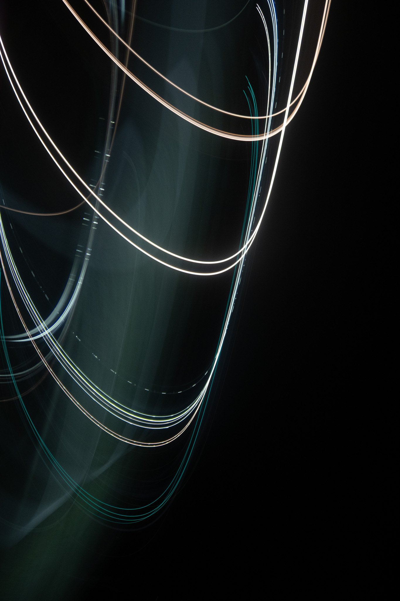 Curving white and teal light trails cross a near-black vertical frame.