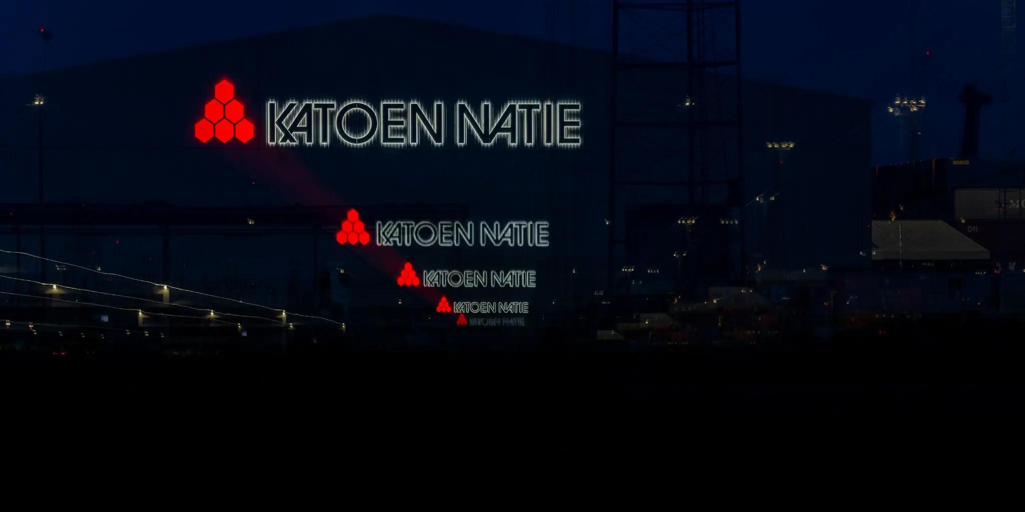 Repeated red industrial signals receding through a black harbor scene
