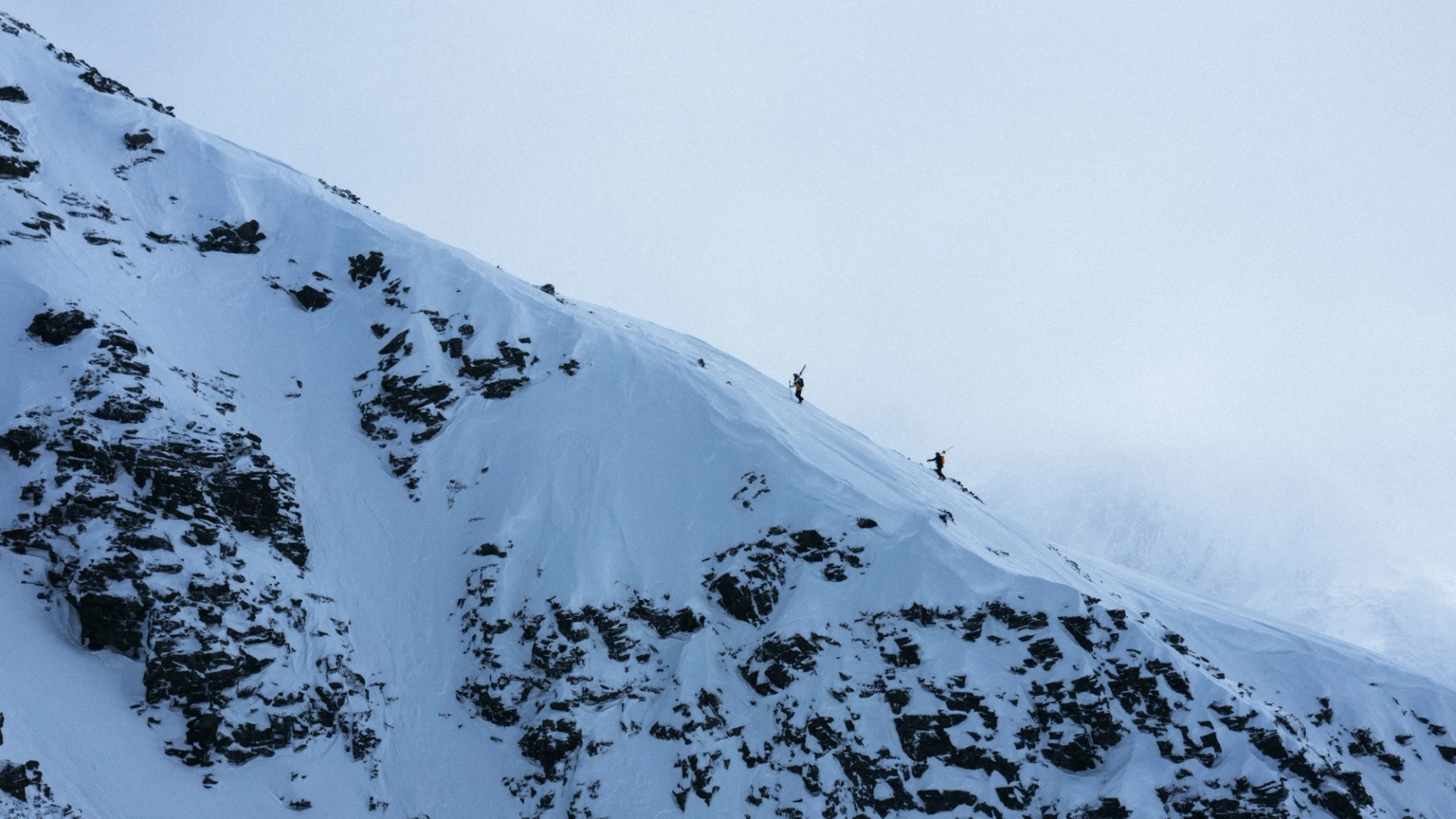 Image of Craig Murray and Kristofer Turdell touring up a ridge