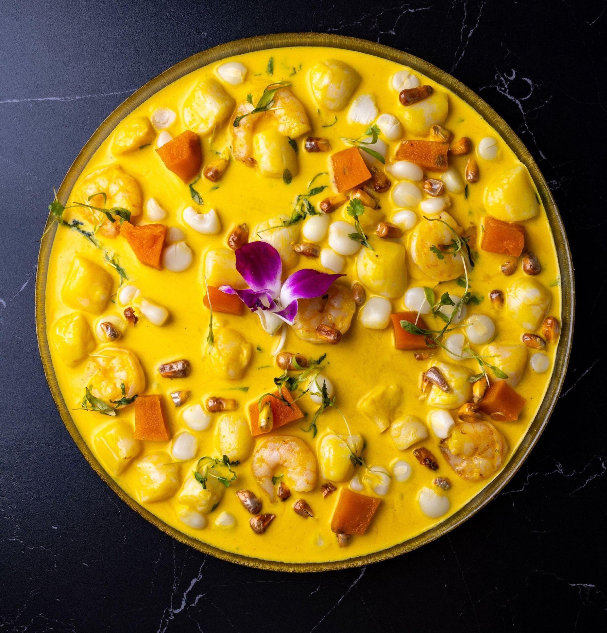 A golden Peruvian seafood dish at Costazul Peruvian Cuisine