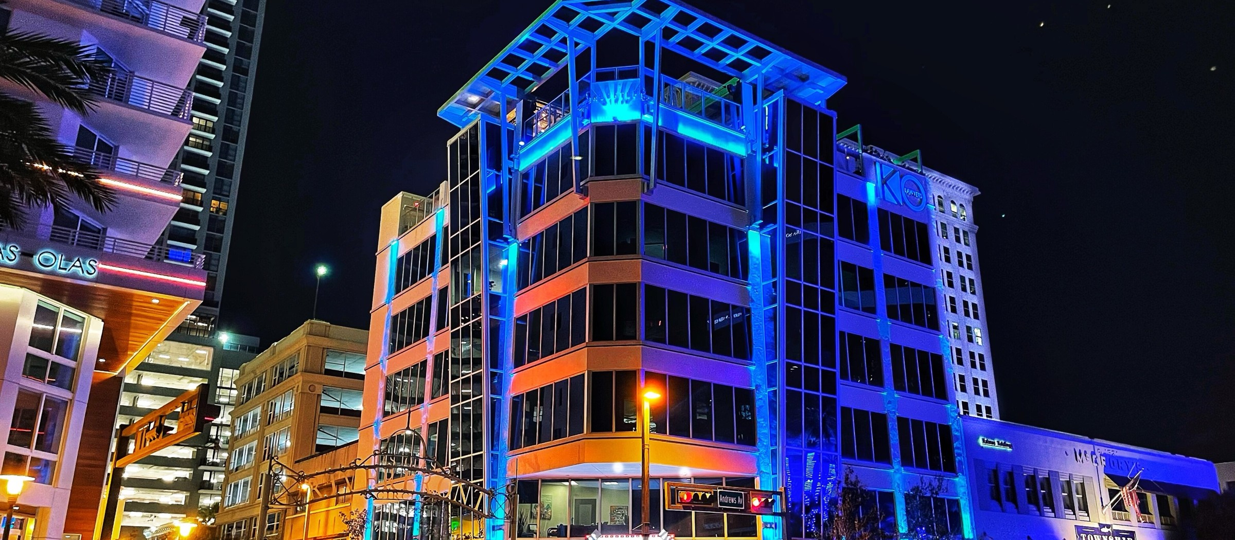 Downtown Fort Lauderdale buildings lit in blue and orange at night