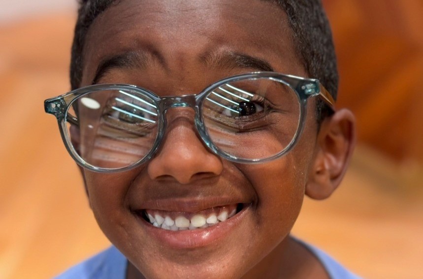 Jamie smiling in glasses