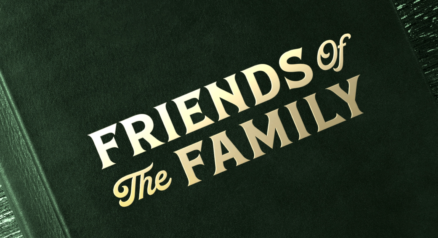 Friends of the Family embossed in gold on green book