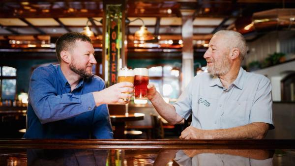 Ken and Brian Grossman cheers beers in the Sierra Nevada taproom
