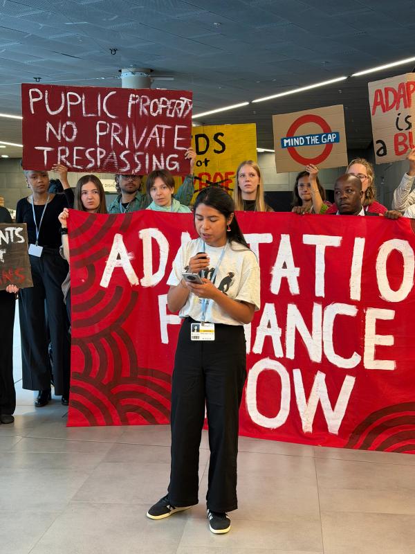 LAYCS Fellows giving a speech with protest signs
