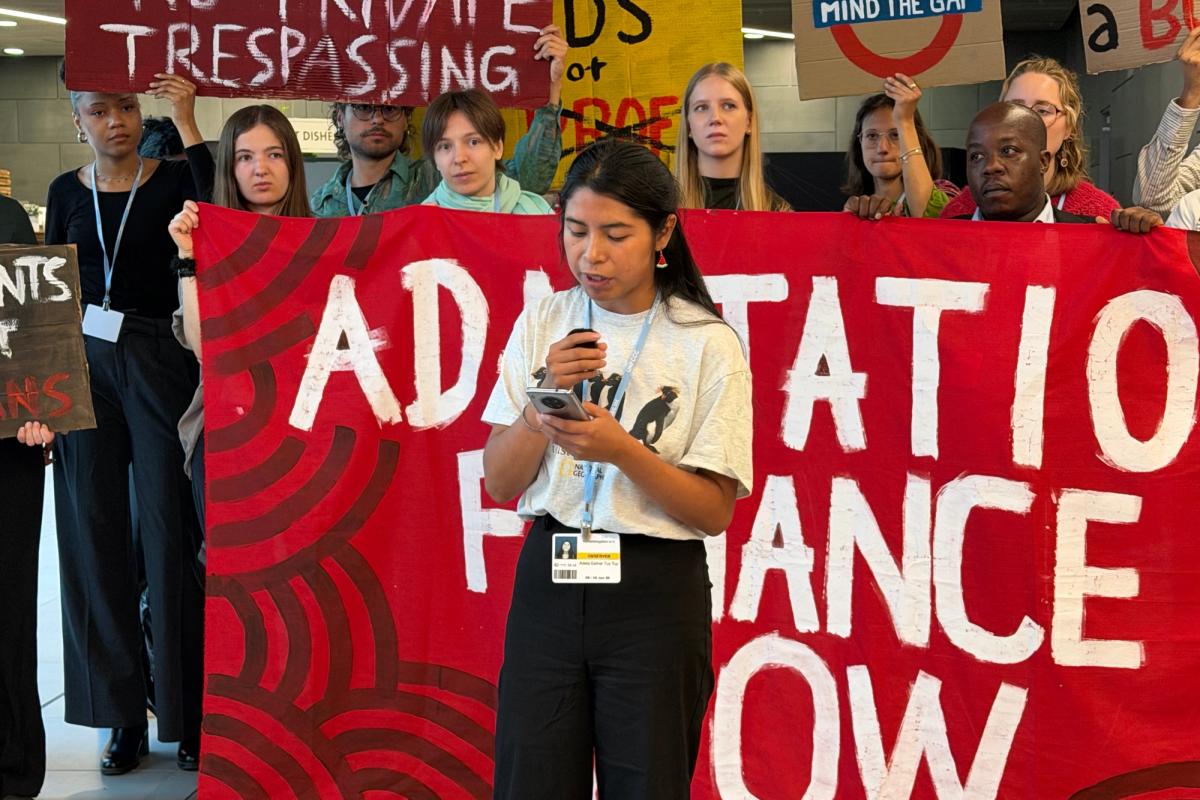 LAYCS Fellows giving a speech with protest signs