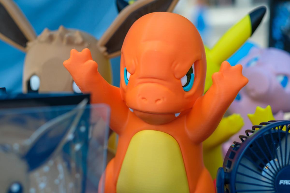 Charmander figure close up, arms raised.