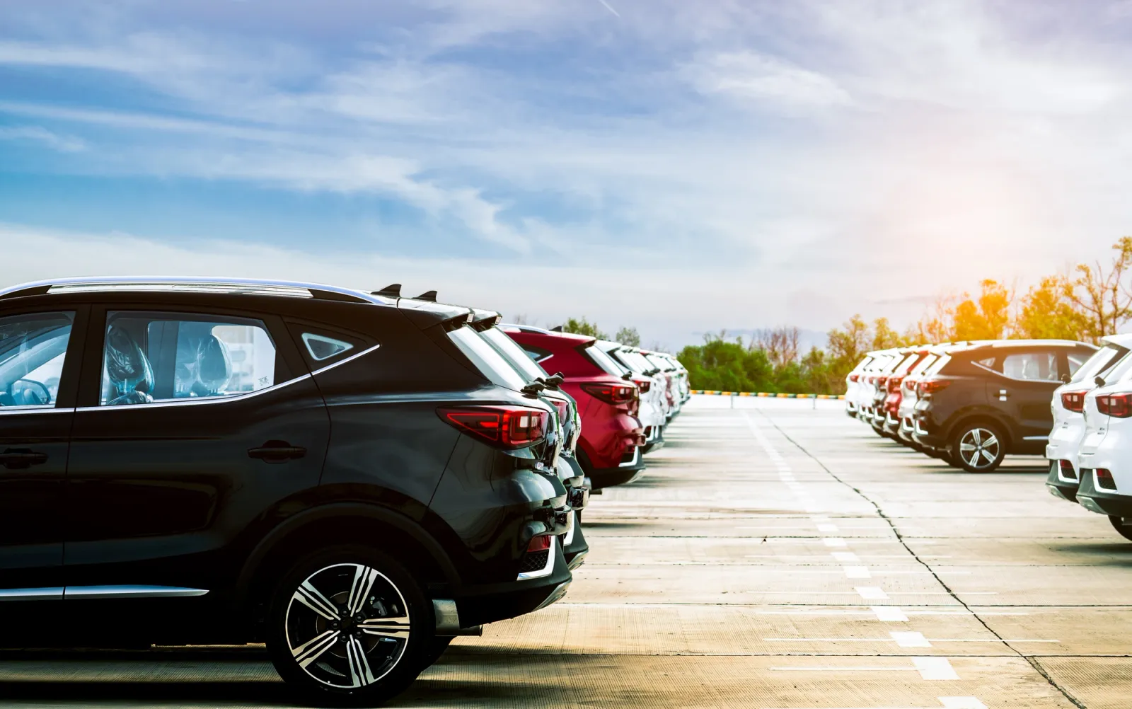 Luxury black, white and red new suv car parked on concrete parki