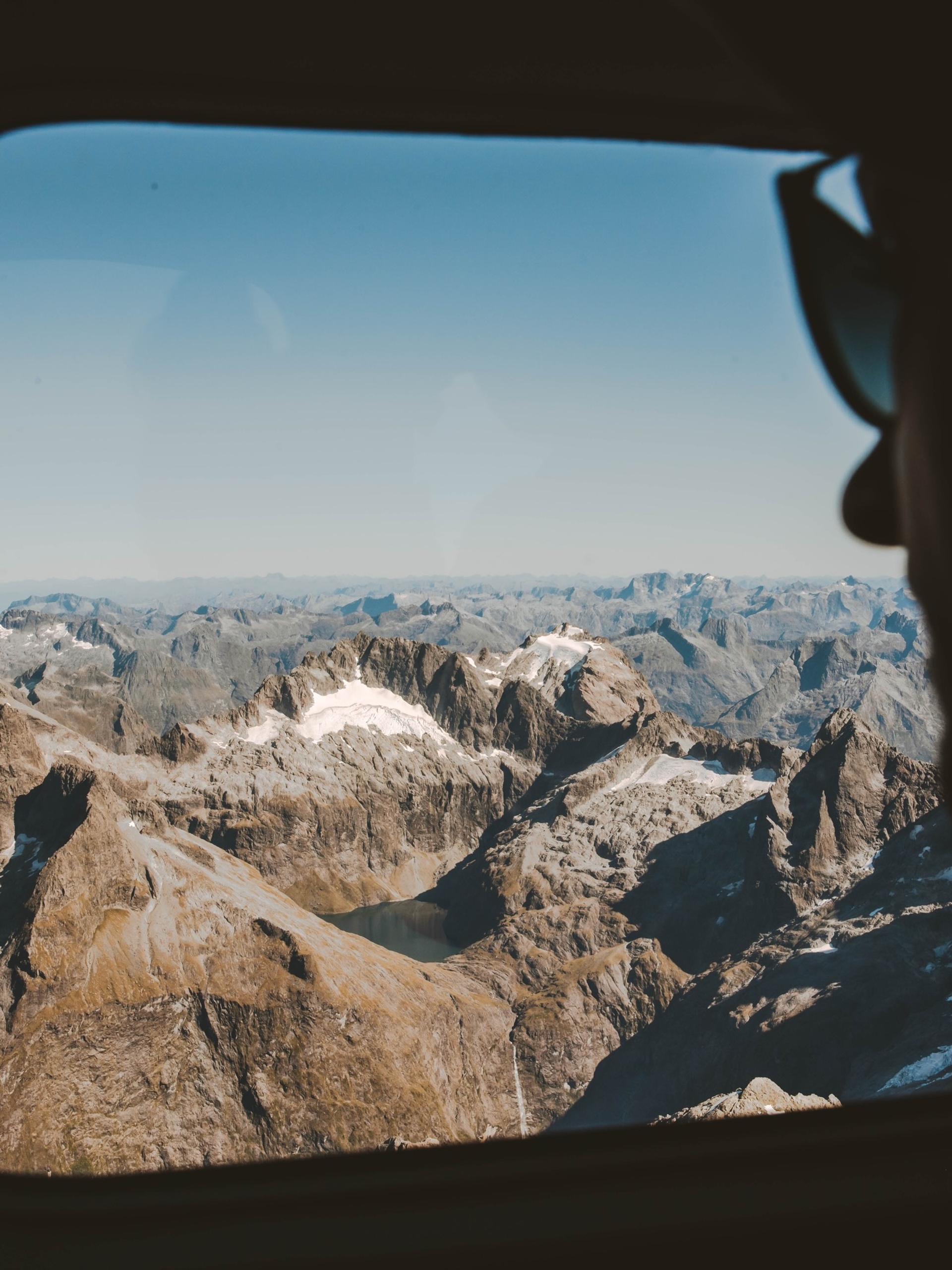 A private helicopter above a remote landscape