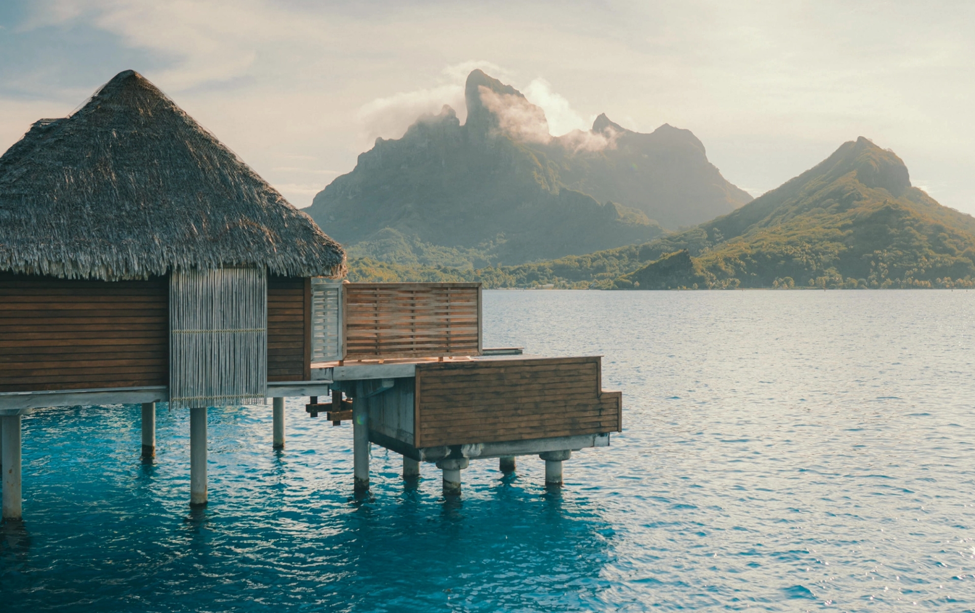 Overwater villas above a Tahitian lagoon