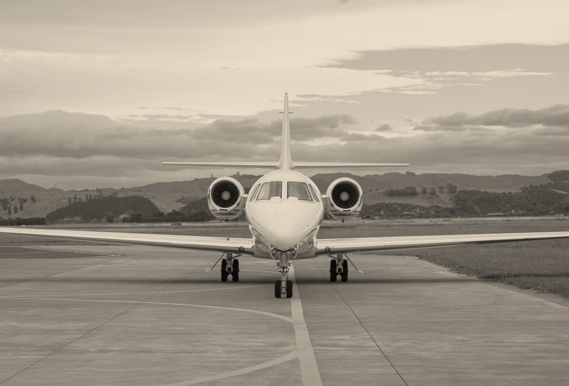 A private jet on an airport runway