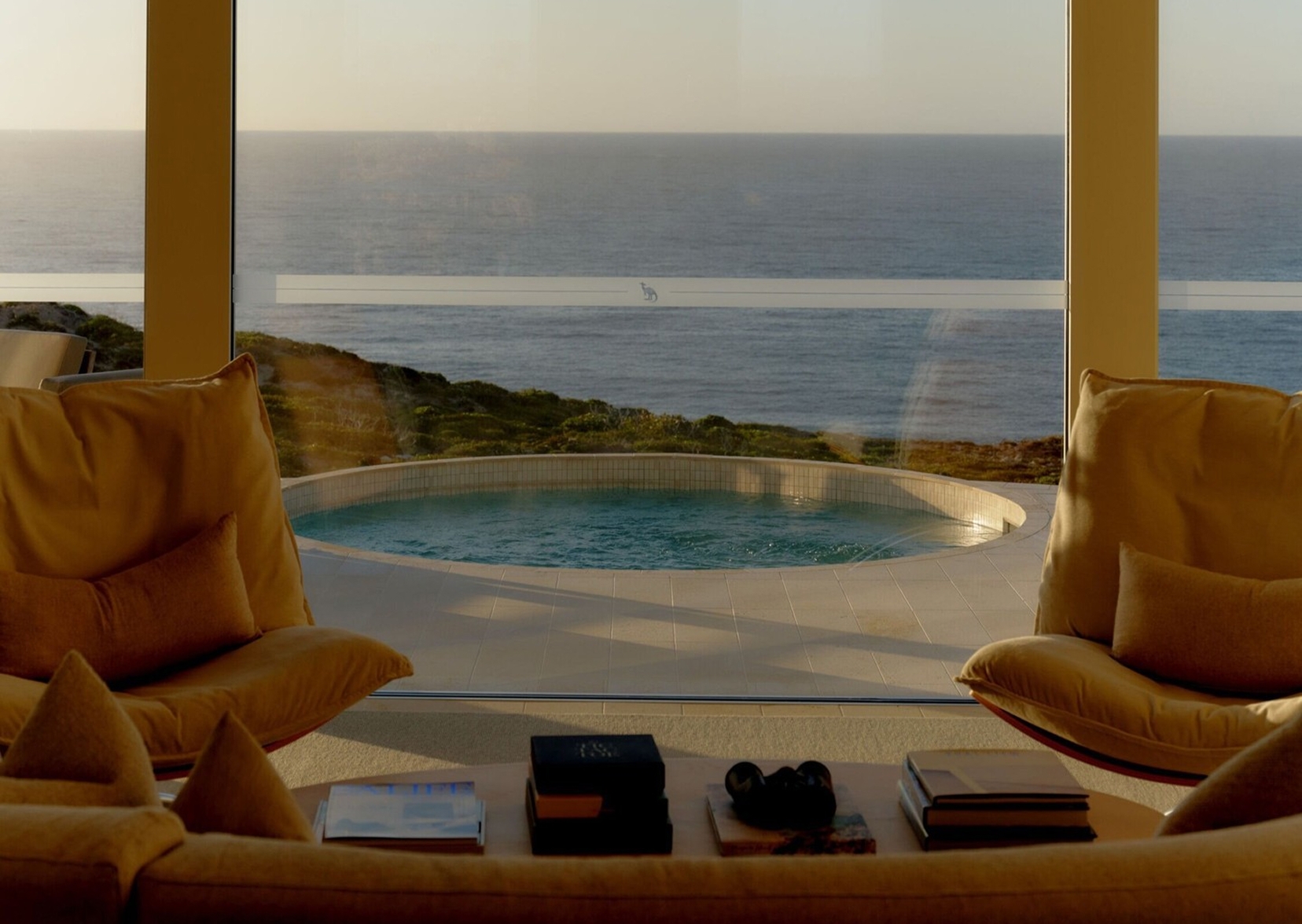 A coastal suite overlooks a private pool and the ocean