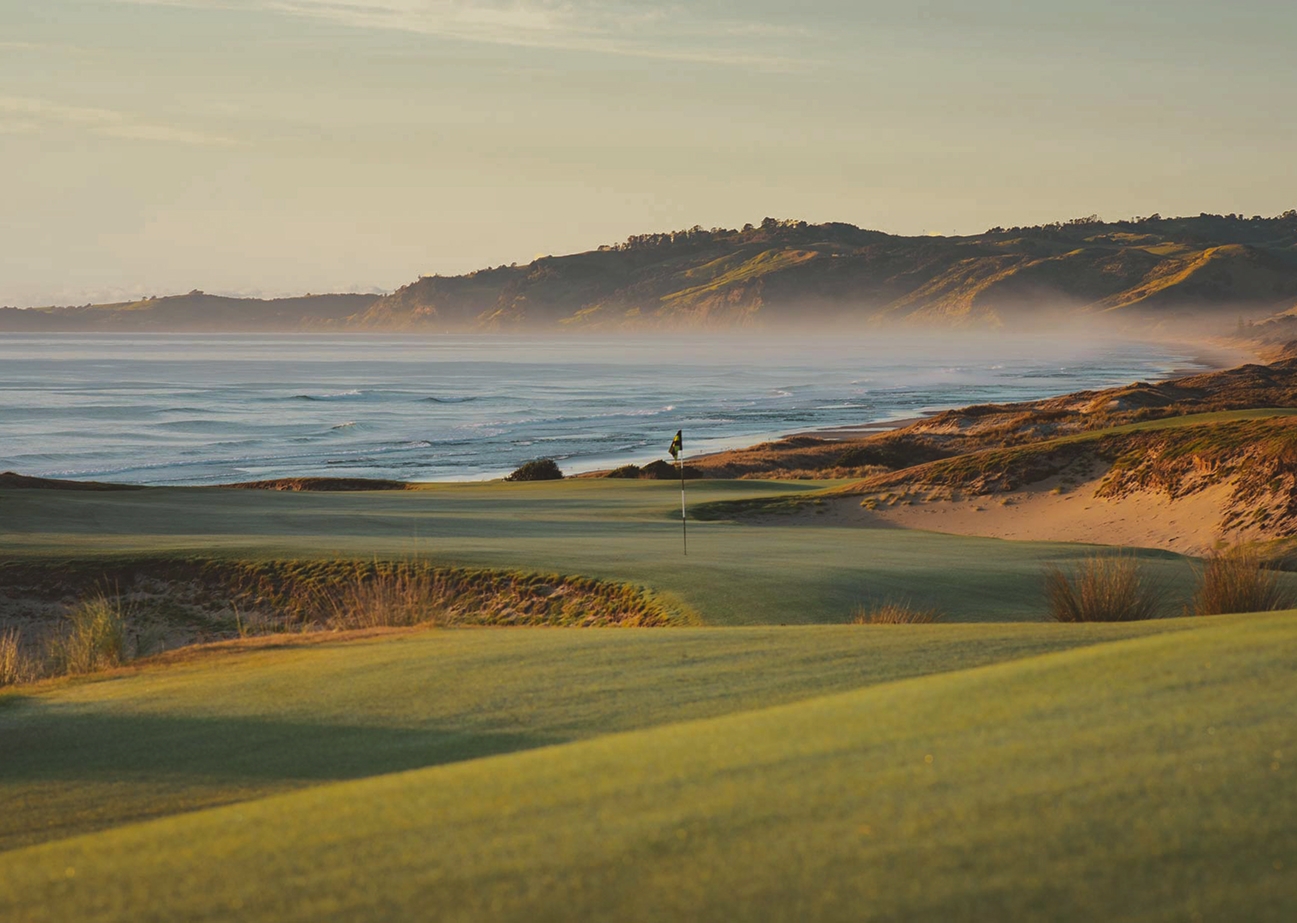 A golfer on a coastal championship fairway