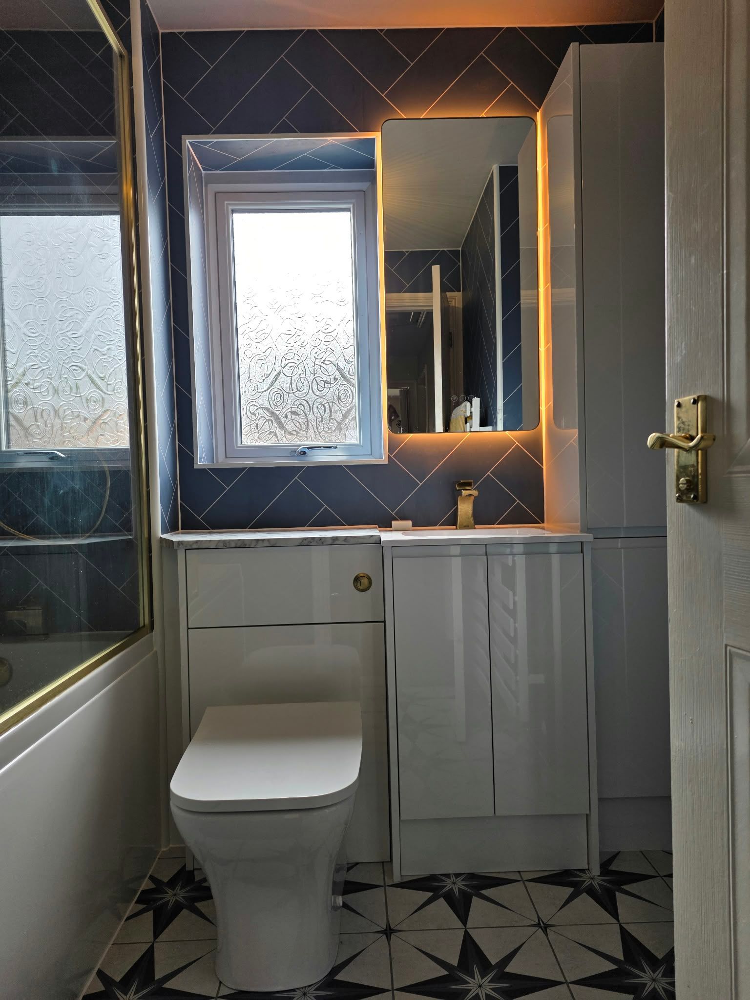 Brass detail bathroom with aqua boards, Rugby