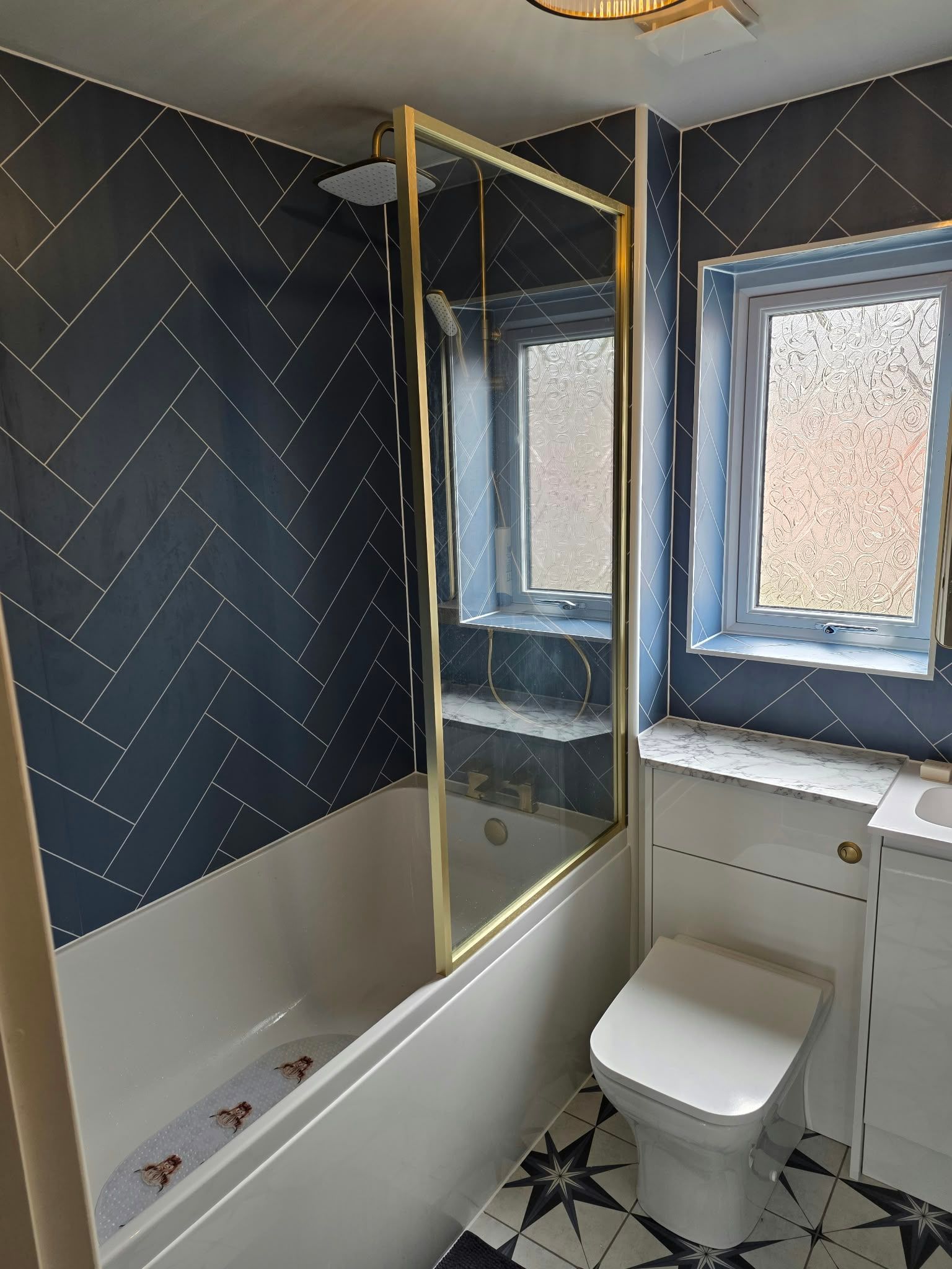 Brass detail bathroom with aqua boards, Rugby