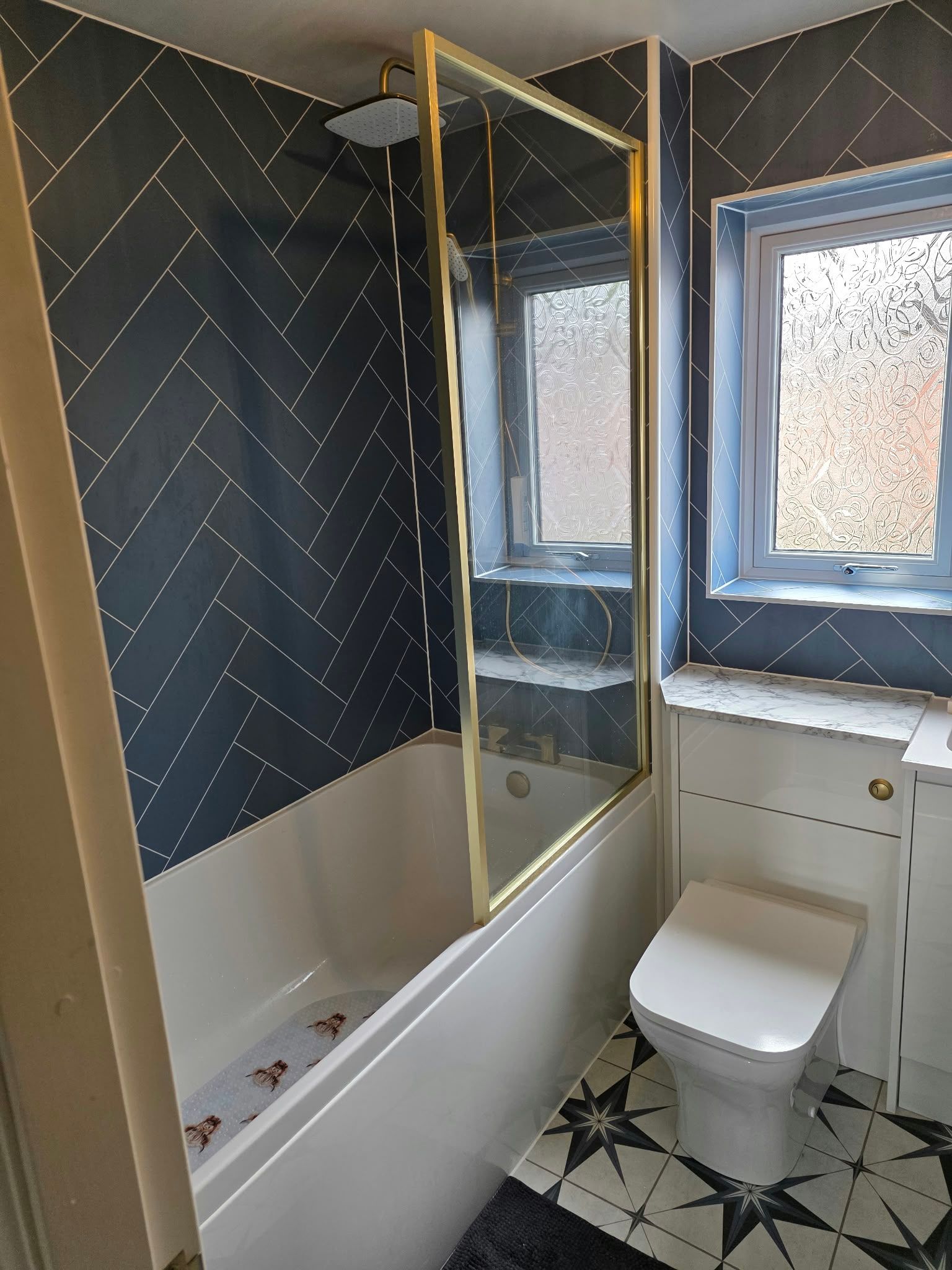 Brass detail bathroom with aqua boards, Rugby