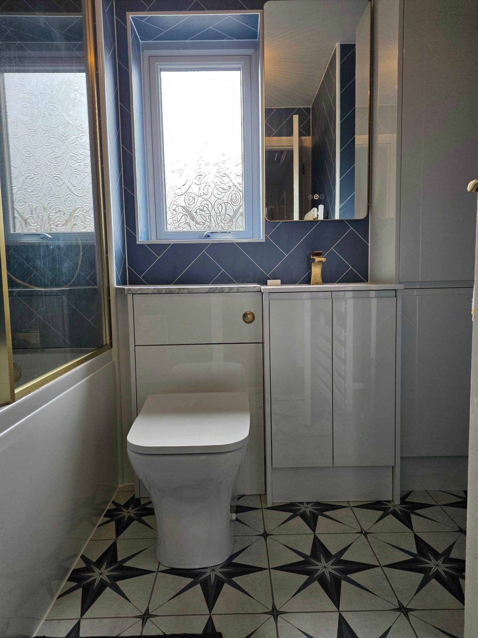 Brass detail bathroom with aqua boards, Rugby