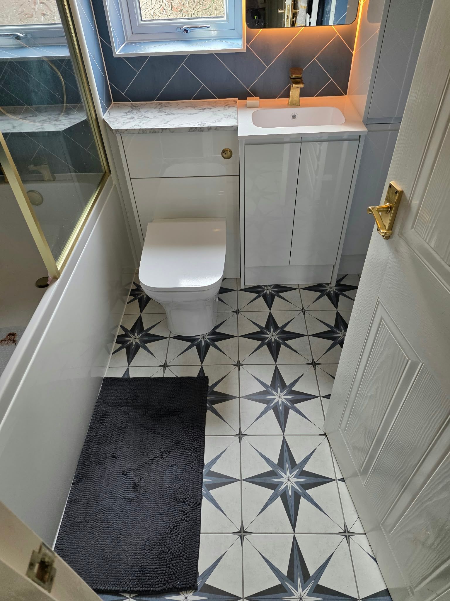 Brass detail bathroom with aqua boards, Rugby