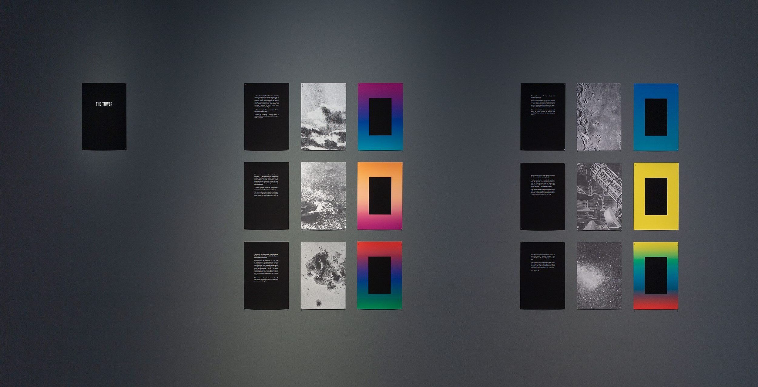 Art installation on a dark wall featuring two columns of black panels with text, each paired with panels containing grayscale images and panels bordered by vibrant gradient colors. A single black panel with white text is on the far left.