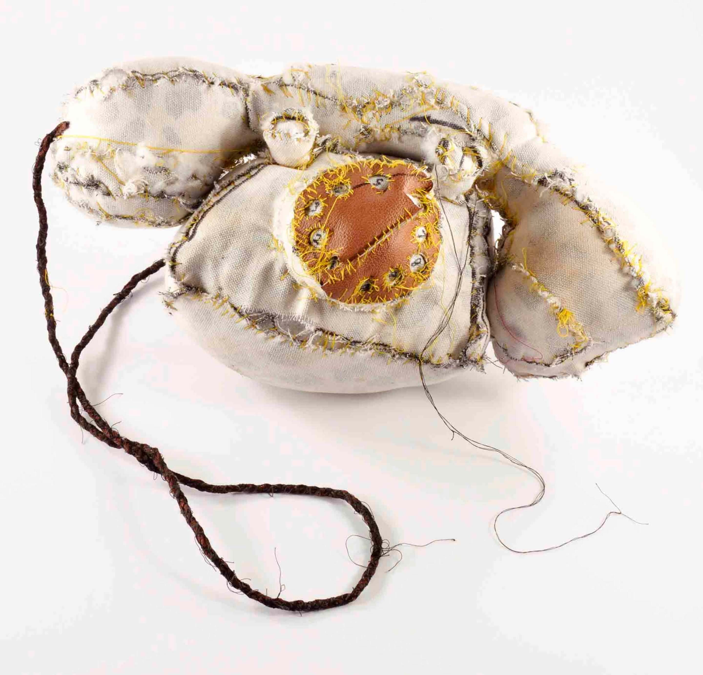 A fabric sculpture of an old-fashioned telephone