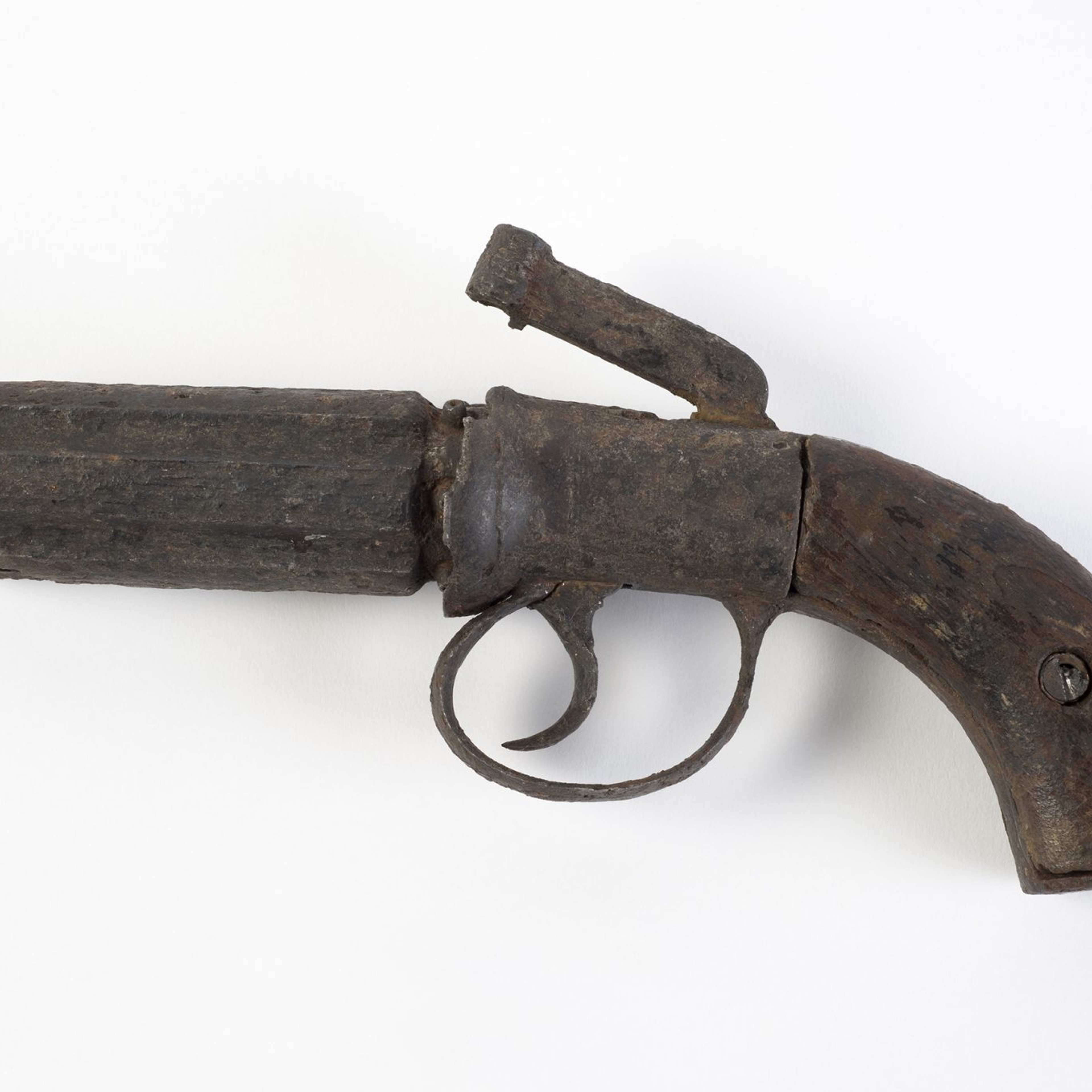 A photograph of an old-fashioned pistol