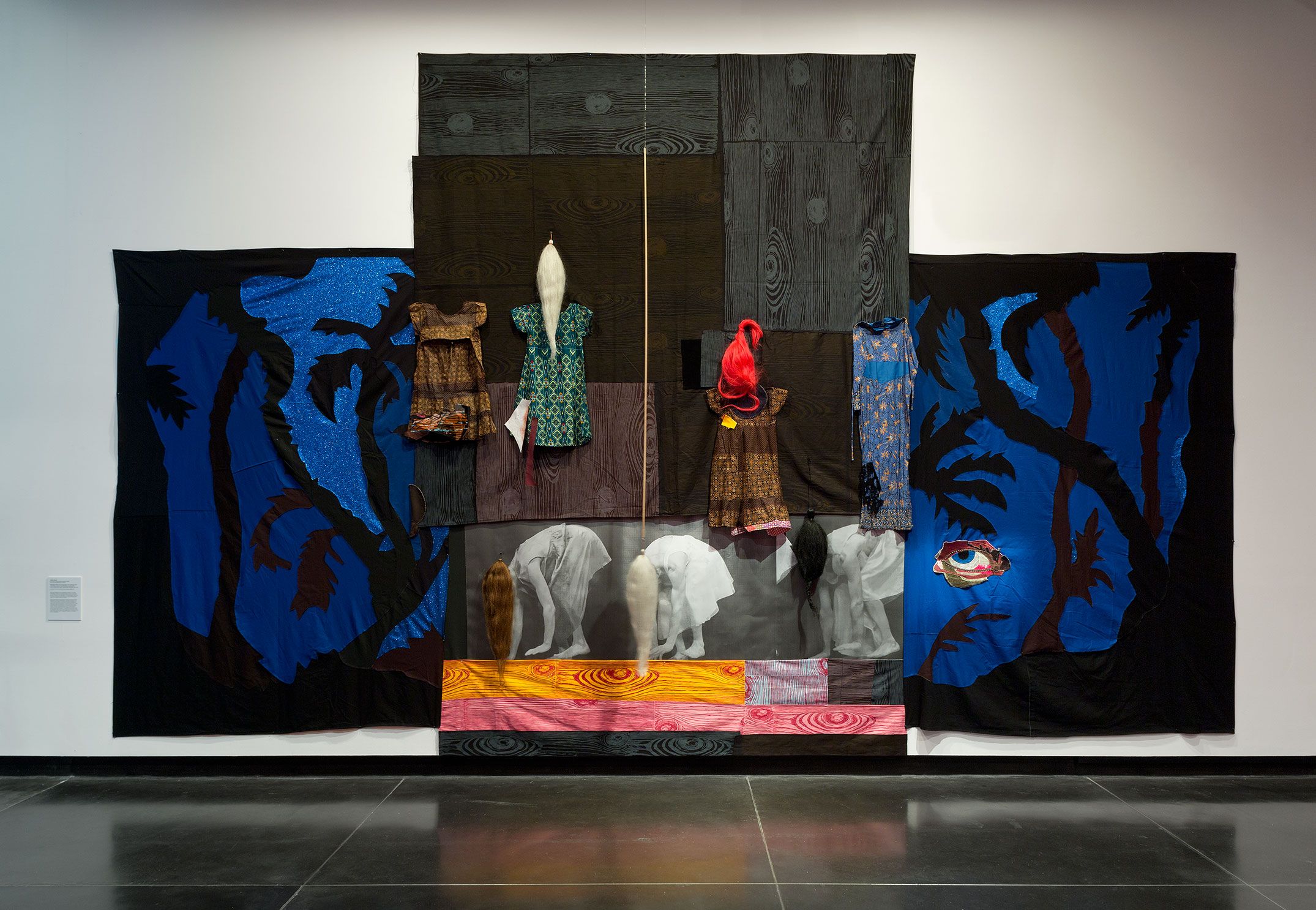 An abstract fabric collage with women bent over