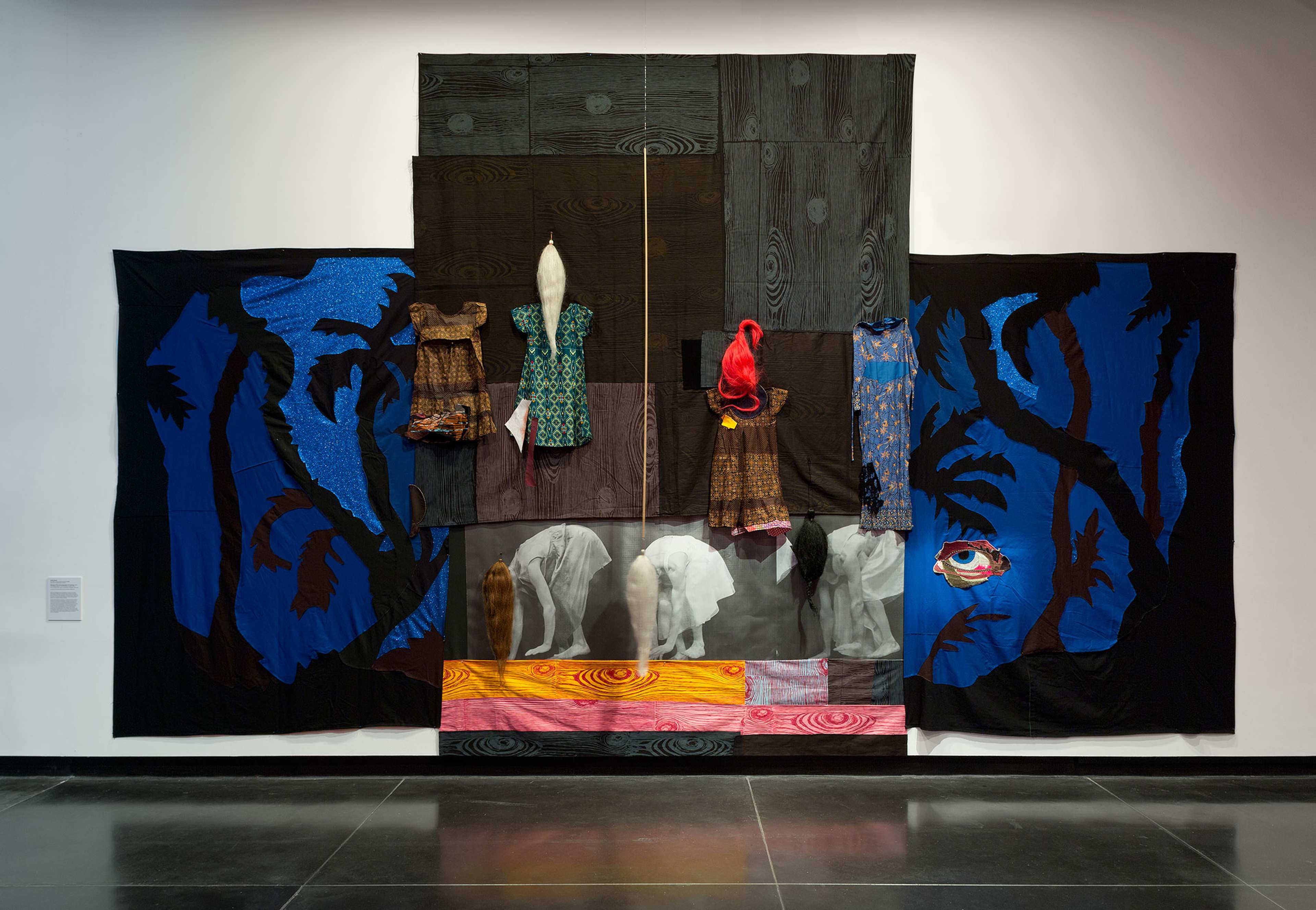 An abstract fabric collage with women bent over