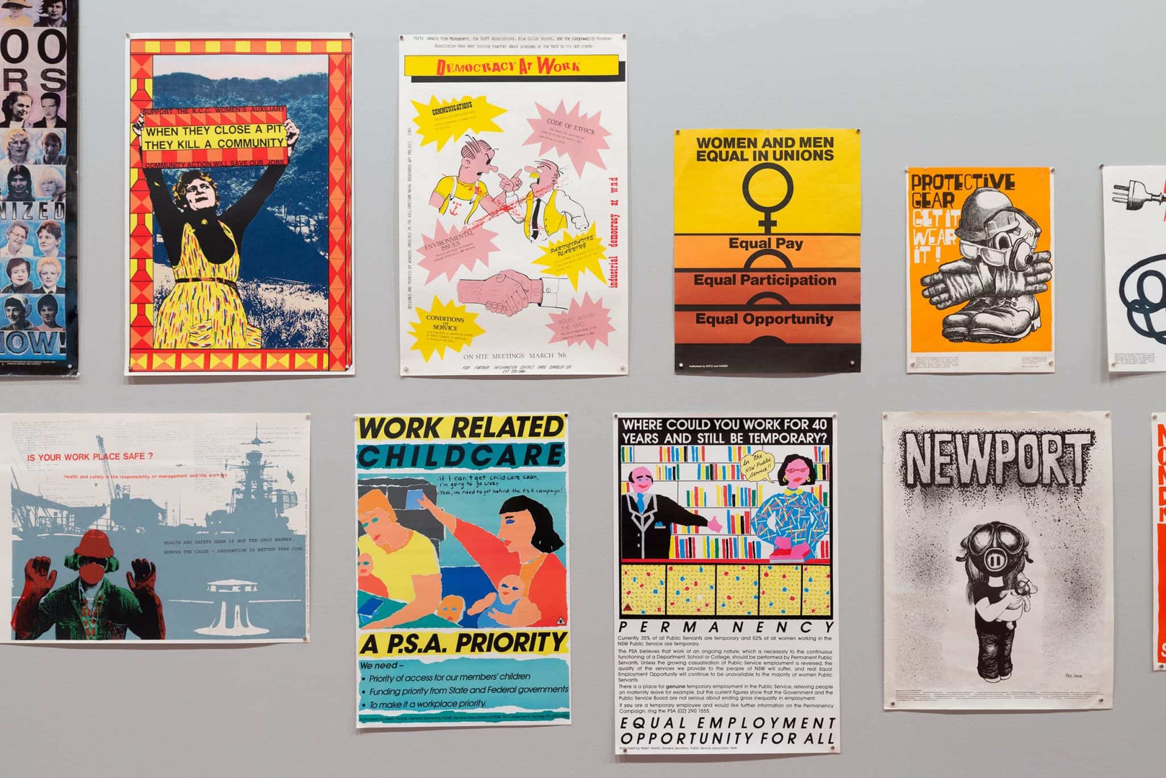 A range of activist posters pinned to a wall