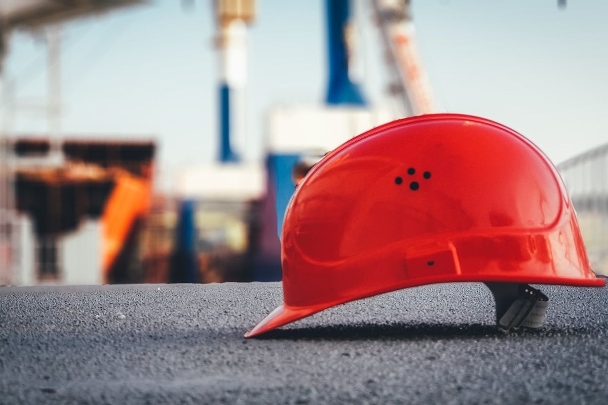 Construction incident investigation with safety equipment and documentation analysis