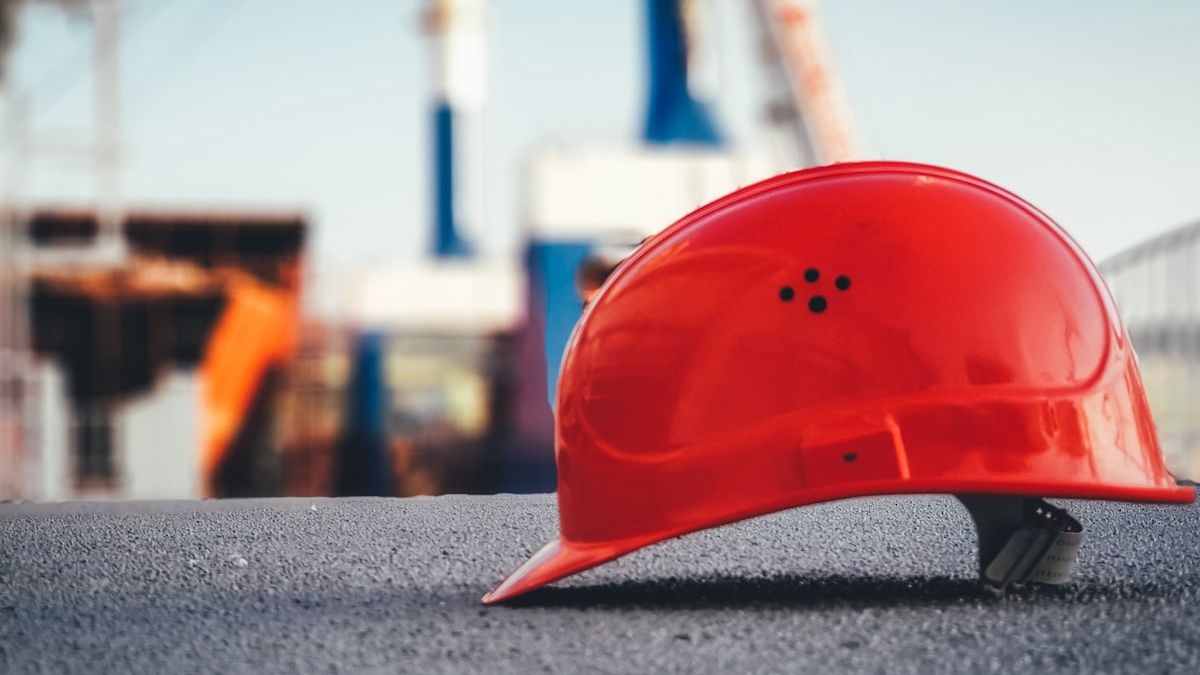 Red construction hard hat and safety equipment for fall protection