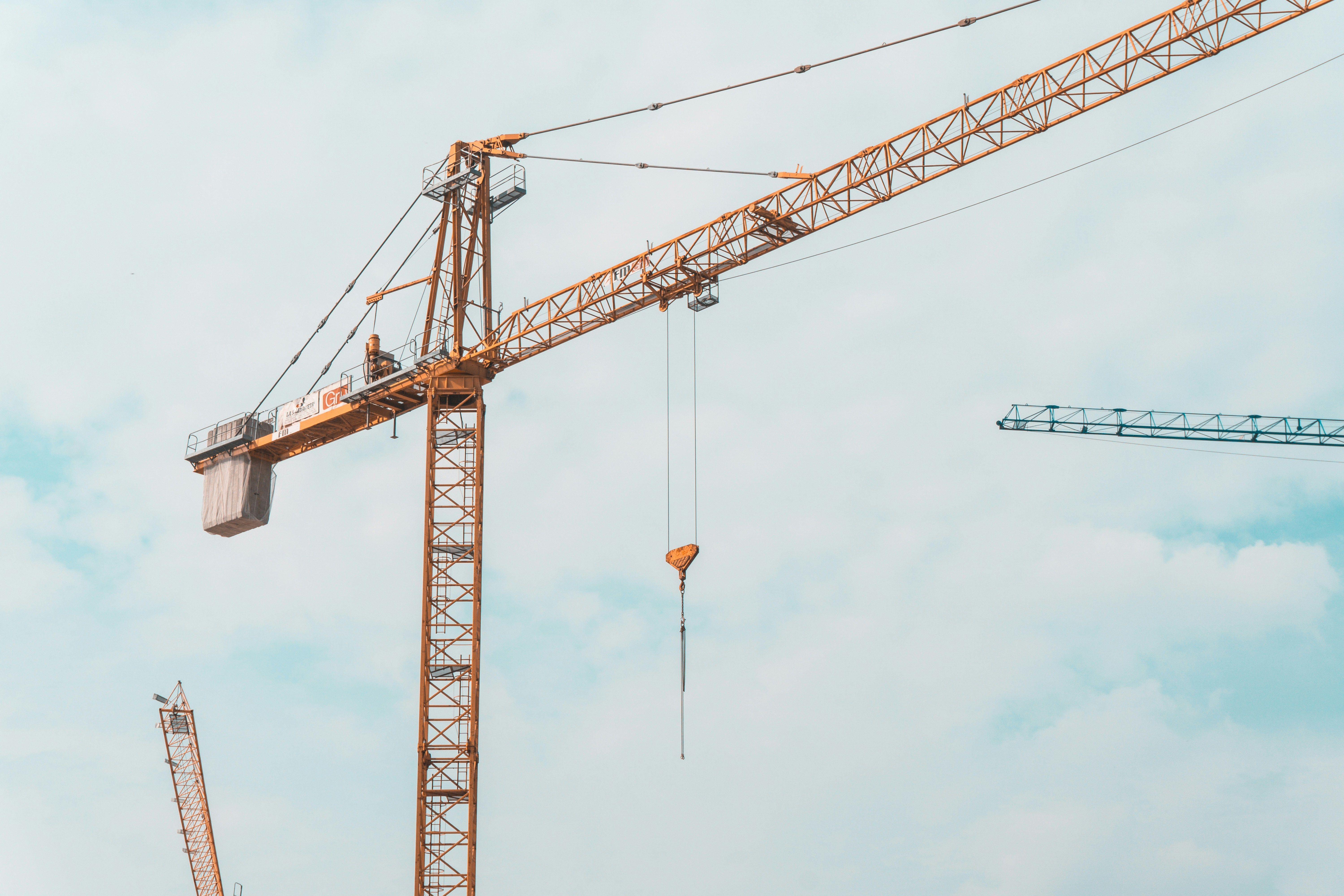 Construction crane and heavy equipment operations with safety protocols
