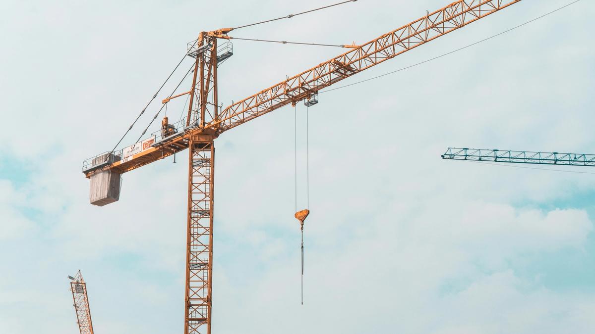 Construction crane and heavy equipment operations with safety protocols