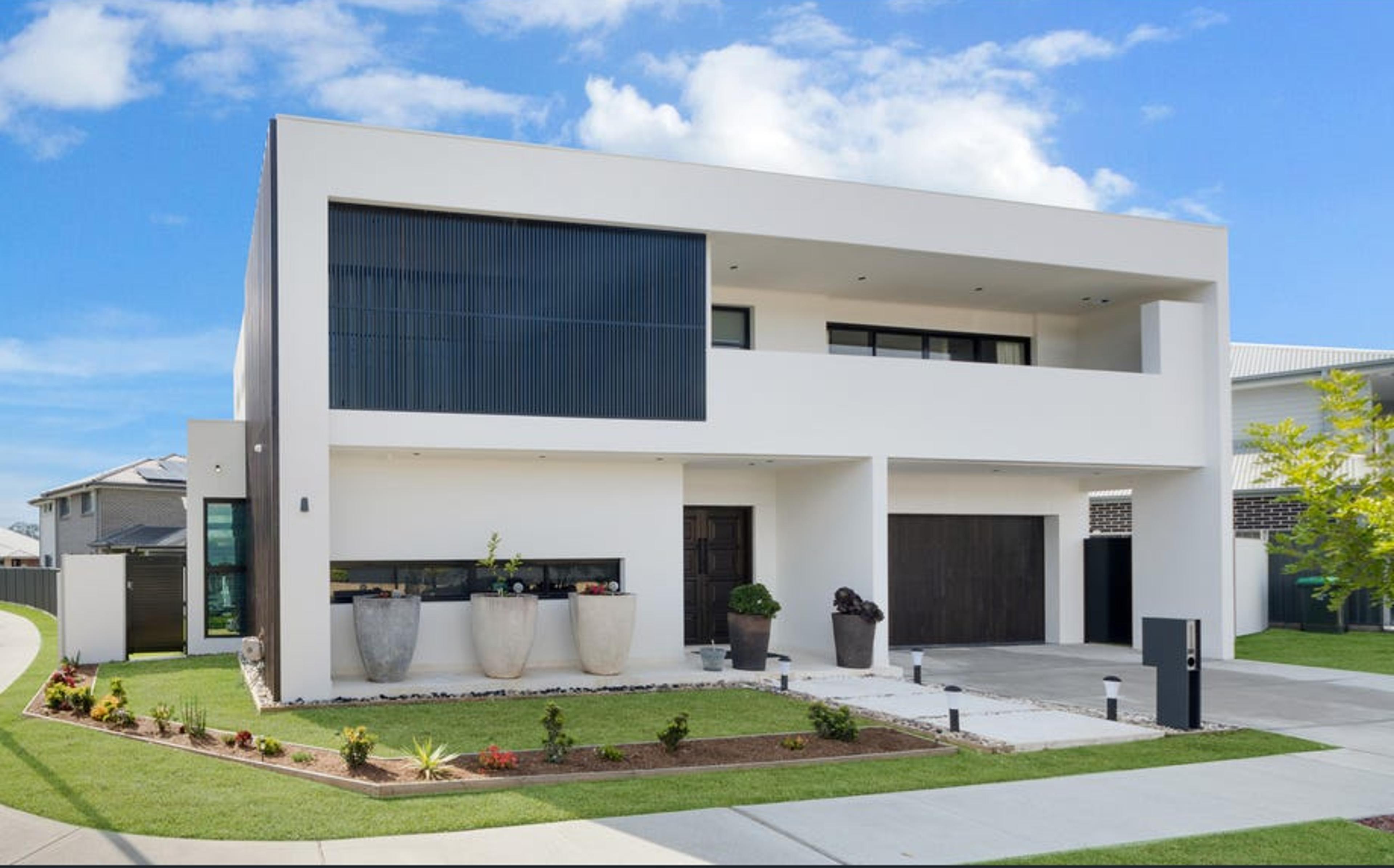 Dezire Homes build, modern facade with monochrome aesthetic