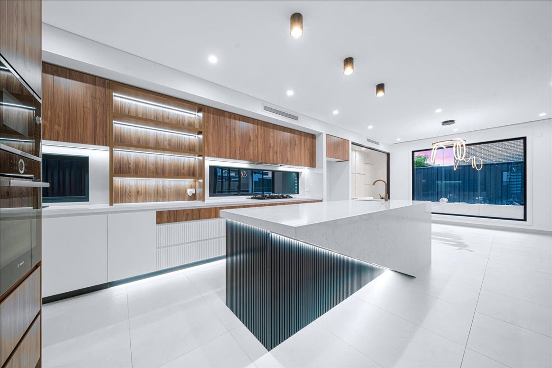 Curved luxury kitchen and timber joinery