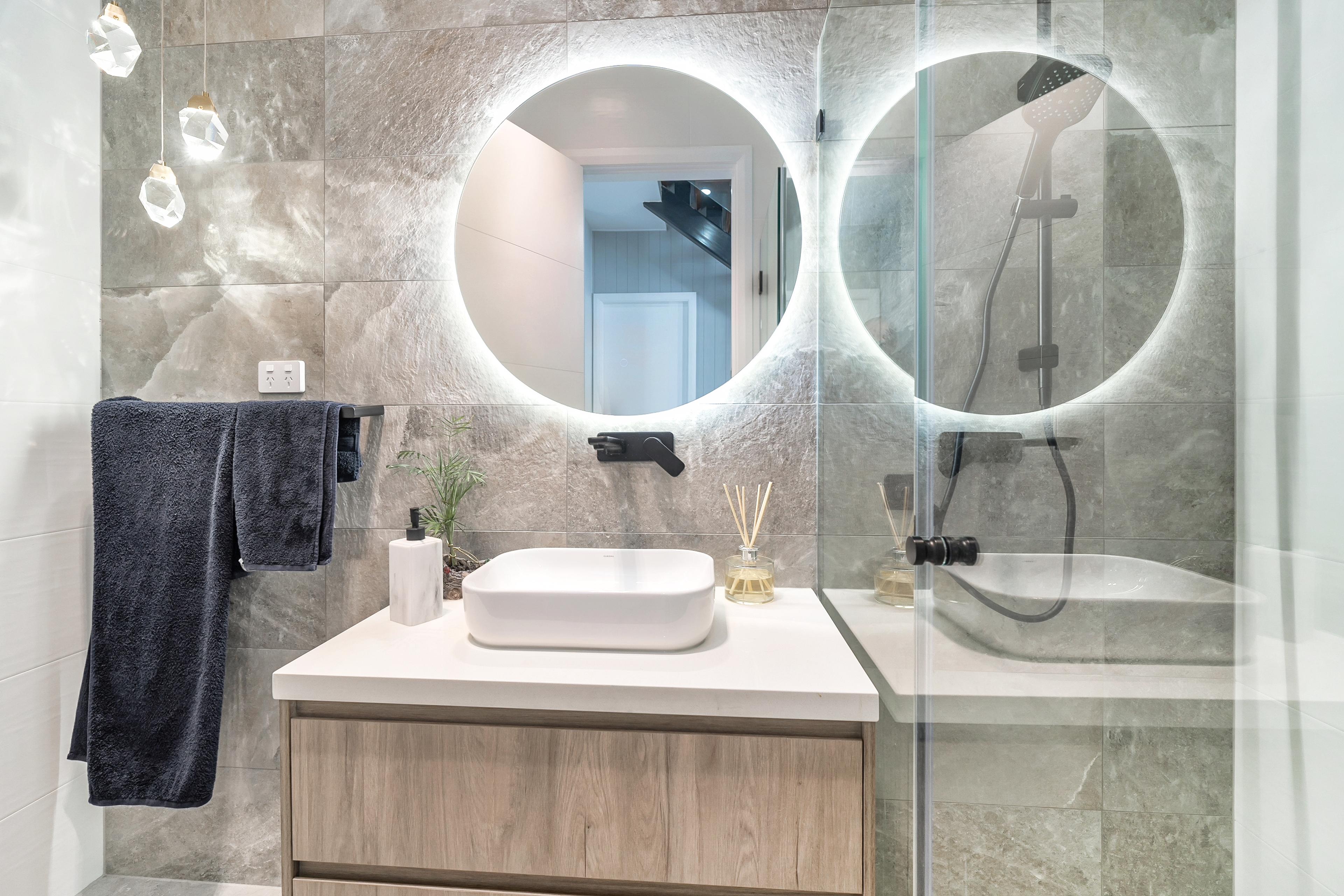 Dezire Homes build, sophisticated vanity with designer accents and a feature wall