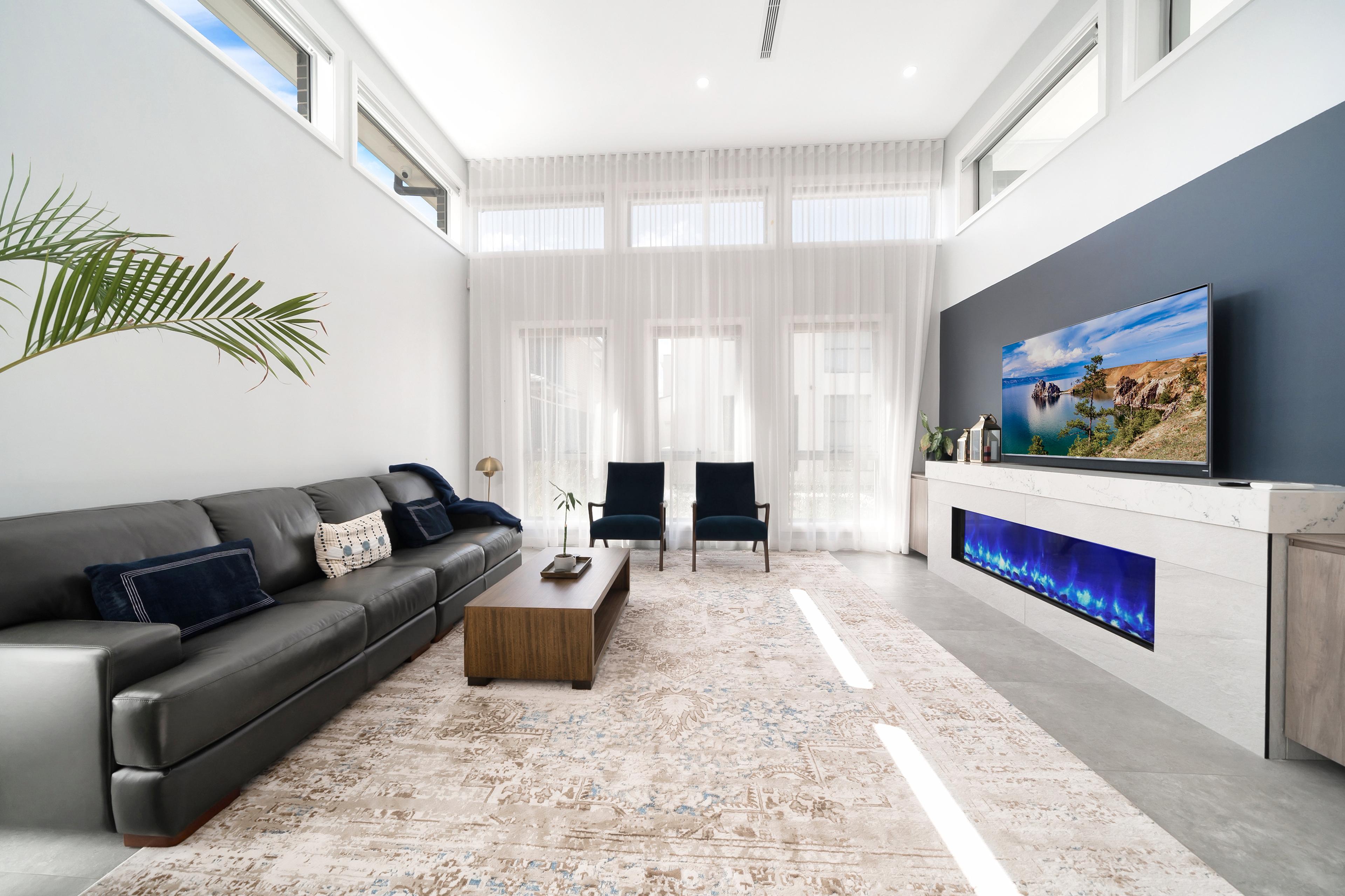 Dezire Homes build, contemprary living room with stylish windows