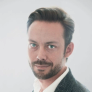 Headshot of Grégory Stoos - CEO & Founder of AISO Hub