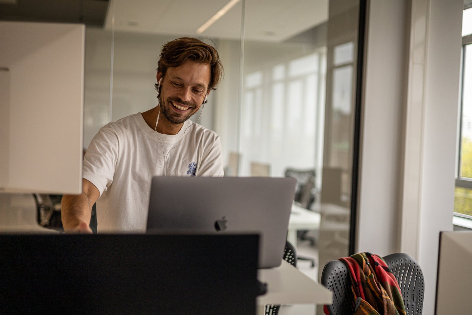 Photo of a Humanoid behind a laptop