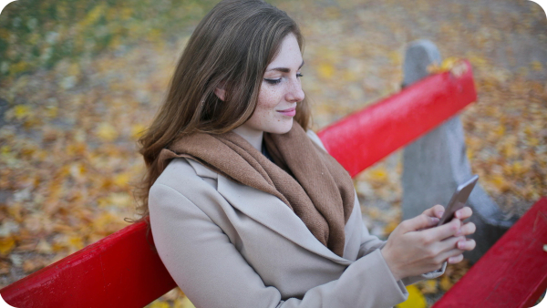 Picture of woman in brown coat sitting