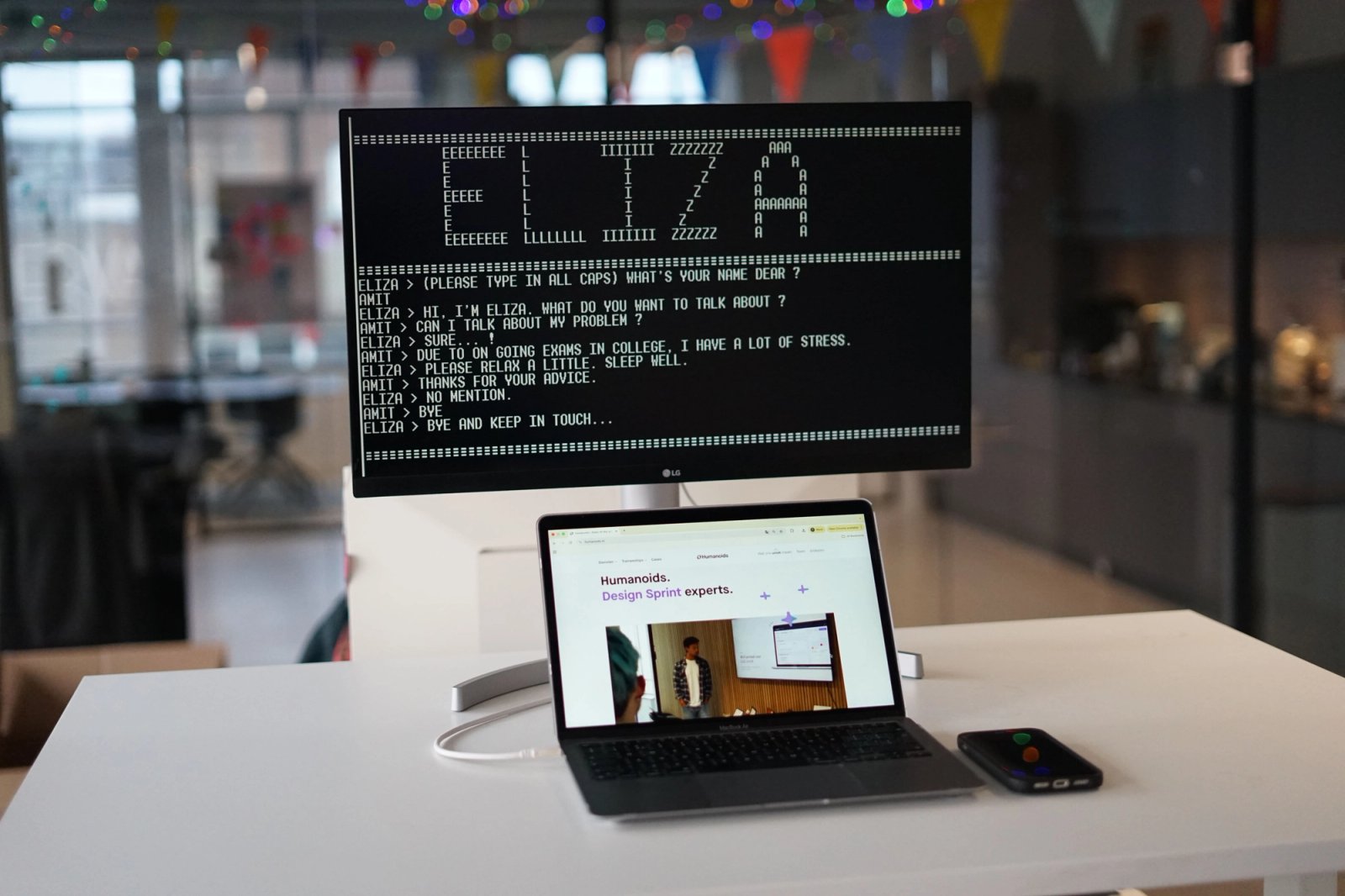 ELIZA chatbot on screen in an office