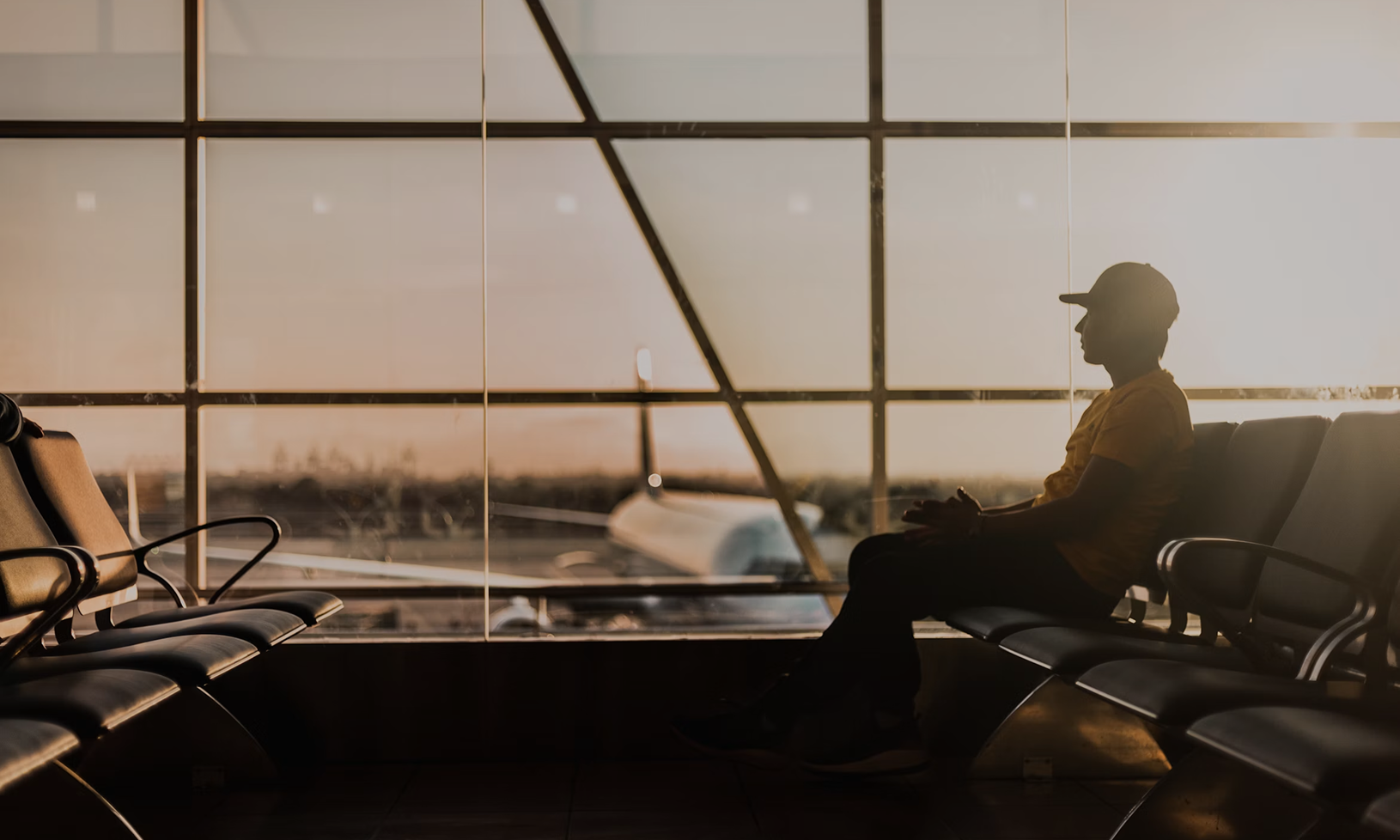 Passenger sitting inside airport terminal