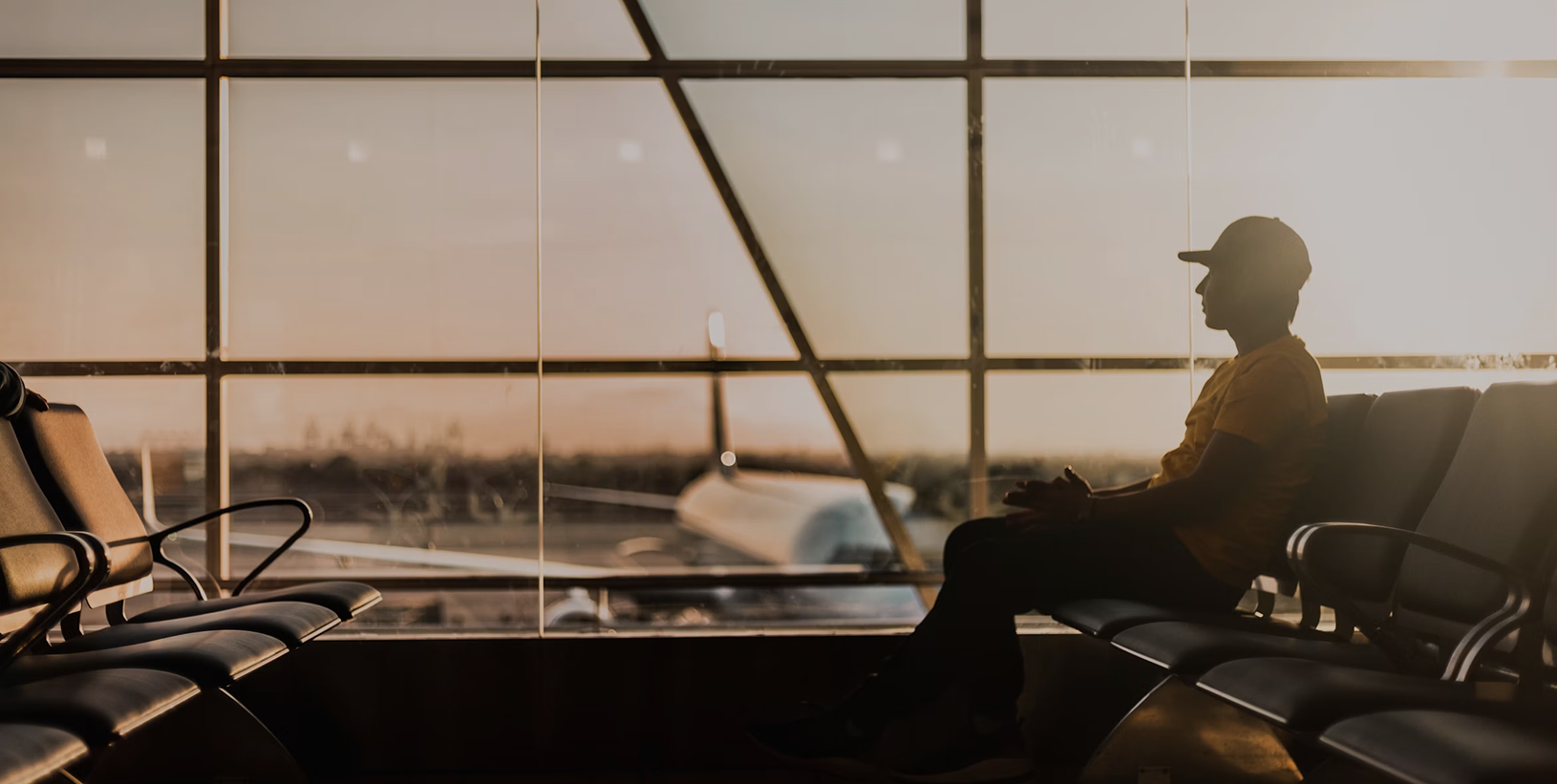 Passenger sitting inside airport terminal